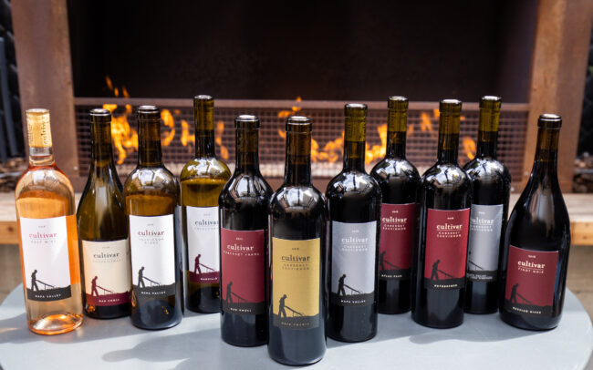 Cultivar wines in front of a cozy fireplace